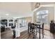 Open-concept dining area with large windows and contemporary furnishings at 4708 Rock Pipit Ct, Highlands Ranch, CO 80126