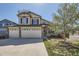 Charming two-story home with a three car garage and well-maintained lawn at 4708 Rock Pipit Ct, Highlands Ranch, CO 80126