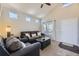 Inviting living room with vaulted ceilings and comfortable furnishings at 4708 Rock Pipit Ct, Highlands Ranch, CO 80126