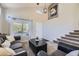 Spacious living room featuring a large window and comfortable seating at 4708 Rock Pipit Ct, Highlands Ranch, CO 80126