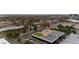 Overhead shot of commercial property, showcasing parking, greenery, and nearby buildings in the urban area at 5700 S Quebec St # A, Englewood, CO 80111