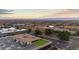 An aerial view of a business complex, a large parking lot, and beautiful mountains in the distance at 5700 S Quebec St # A, Englewood, CO 80111