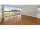 A spacious bedroom with a hardwood floor and large windows at 5700 S Quebec St # A, Englewood, CO 80111