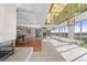 Bright dining area with a view and mirrored ceiling adjoins an open kitchen and living room at 5700 S Quebec St # A, Englewood, CO 80111