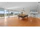 Spacious game room with a pool table, bar area, and floor-to-ceiling windows offering stunning views at 5700 S Quebec St # A, Englewood, CO 80111
