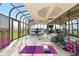 Unique home gym with weight racks, treadmill, desk area and solarium windows at 5700 S Quebec St # A, Englewood, CO 80111