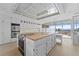 Bright kitchen with a central island, wood countertops, stainless steel appliances, and natural light at 5700 S Quebec St # A, Englewood, CO 80111