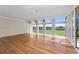 Expansive living room with wood floors, floor-to-ceiling windows, and lots of light at 5700 S Quebec St # A, Englewood, CO 80111