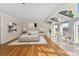 Spacious main bedroom with wood and tile flooring, skylights, and a seating area at 5700 S Quebec St # A, Englewood, CO 80111