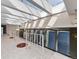 Bright solarium with skylights, chandeliers, white tile, and unique red rock features at 5700 S Quebec St # A, Englewood, CO 80111