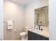 Well-lit bathroom featuring marble-style walls, a modern sink, and sleek black fixtures with glass shower at 1901 Wazee St # 1020, Denver, CO 80202