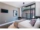 Chic bedroom with a modern chandelier and city views at 1901 Wazee St # 1020, Denver, CO 80202