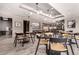 A stylish dining area with modern tables, chairs, and unique lighting fixtures at 1901 Wazee St # 1020, Denver, CO 80202