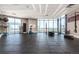 Bright fitness center with free weights, machines, and city views from large windows at 1901 Wazee St # 1020, Denver, CO 80202