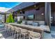 Outdoor kitchen area featuring a grill, bar seating, and city views at 1901 Wazee St # 1020, Denver, CO 80202