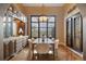Dining room with tile flooring, large window and custom built-in hutch at 8417 High Ridge Ct, Castle Pines, CO 80108
