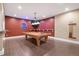 Spacious game room with a pool table, perfect for entertaining guests and Gathering fun at 8417 High Ridge Ct, Castle Pines, CO 80108