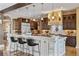 Gourmet kitchen featuring a large center island, custom cabinets, and professional appliances at 8417 High Ridge Ct, Castle Pines, CO 80108