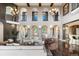 Bright living room featuring a wall of windows and elegant decor at 8417 High Ridge Ct, Castle Pines, CO 80108