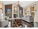 The living room boasts a fireplace, decorative lighting, and stylish seating options at 8417 High Ridge Ct, Castle Pines, CO 80108