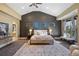 Spacious main bedroom with vaulted ceiling, accent wall, and sitting area near a large window at 8417 High Ridge Ct, Castle Pines, CO 80108