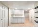 Finished basement with cabinets for storage or entertaining space at 1832 S Tamarac St, Denver, CO 80231