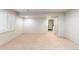 Spacious basement with neutral carpet, white walls, and natural light at 1832 S Tamarac St, Denver, CO 80231