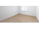 Bedroom featuring neutral walls, carpet, and a window for natural light at 1832 S Tamarac St, Denver, CO 80231