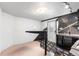 Kitchenette featuring sleek black cabinets, decorative backsplash, and stylish flooring at 1832 S Tamarac St, Denver, CO 80231