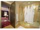 Updated bathroom showing tiled glass shower and doorway to bedroom at 460 Garfield St, Denver, CO 80206