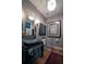 Stylish powder room with vessel sink, wall art and modern light fixture at 460 Garfield St, Denver, CO 80206
