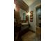 Stylish bathroom features a vessel sink, decorative mirror, and unique bronze wall accents at 460 Garfield St, Denver, CO 80206