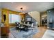 Bright dining room with modern lighting fixture, large windows, and seating for six, creating an inviting atmosphere at 460 Garfield St, Denver, CO 80206