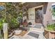 Inviting front porch with stone accents, modern door, and landscaped surroundings at 460 Garfield St, Denver, CO 80206