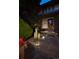 Well-lit front entrance with stone pathway, water feature, and manicured bushes at 460 Garfield St, Denver, CO 80206