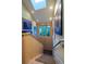 Staircase with wood paneling and artwork leads to a bright skylight at 460 Garfield St, Denver, CO 80206