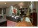 Large living room with modern decor, fireplace and tall windows at 460 Garfield St, Denver, CO 80206