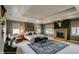 Serene main bedroom with a fireplace, large bed, soft lighting, and decorative accents for a luxurious retreat at 460 Garfield St, Denver, CO 80206