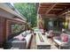 Stylish patio area with comfortable seating, a modern fire pit, and lush plantings, ideal for relaxation at 460 Garfield St, Denver, CO 80206