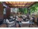 Cozy covered patio with comfortable seating around a fire pit, perfect for outdoor entertaining at 460 Garfield St, Denver, CO 80206