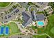 Aerial view of the clubhouse, pool, tennis courts, and surrounding community at 7879 S Zante Ct, Aurora, CO 80016