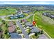 Aerial view of home in Primary-planned community, showing golf course, tennis courts and community center at 7879 S Zante Ct, Aurora, CO 80016