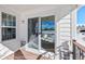 Covered back porch area with sliding glass door to the interior at 7879 S Zante Ct, Aurora, CO 80016
