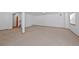 Finished basement featuring neutral carpet and white walls, ideal for recreation or additional living space at 7879 S Zante Ct, Aurora, CO 80016