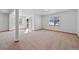 Expansive carpeted basement featuring a sliding glass door and several windows offering natural light at 7879 S Zante Ct, Aurora, CO 80016