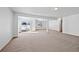 Open basement with neutral carpet, offering ample space for entertaining and relaxation at 7879 S Zante Ct, Aurora, CO 80016