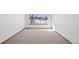 Bright bedroom with large window and neutral carpet at 7879 S Zante Ct, Aurora, CO 80016