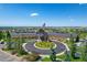 Front view of the community clubhouse with a circular driveway and lush landscaping at 7879 S Zante Ct, Aurora, CO 80016