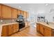Well-lit kitchen features wood floors, a stainless steel oven, and ample counter space for meal prep at 7879 S Zante Ct, Aurora, CO 80016