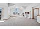 Living room featuring a fireplace, vaulted ceilings, large windows, and lots of natural light at 7879 S Zante Ct, Aurora, CO 80016